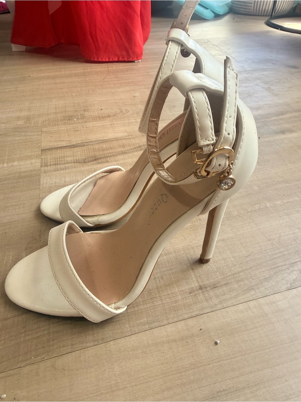 Elegant White Ankle-Strap Stiletto Heels with Gold Accent